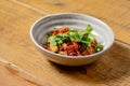 Georgian vegetable and meat salad with onion, basil, tomato, parsley and pepper Royalty Free Stock Photo