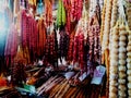 Georgian wide range of colourful traditional food on sale in small street market shop - closeup on sausage-shaped churchkhela