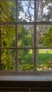 Georgian window overlooking wooded grounds. Royalty Free Stock Photo