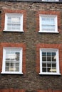 Georgian windows architecture on a wall house, London, UK