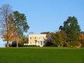 Historical 1865 yellow house on the hilltop blue sky in FingerLakes autumn