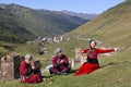 Georgian people in their traditional, local dresses have a nice time all together in the Caucasus Mountains.