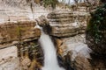 Georgous waterfall on the mountain river among the rocks and trees