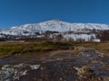 Geothermal area Geysir in Haukadalur, Iceland, Golden Circle, in winter with hot spring, green meadow and mountains. Royalty Free Stock Photo