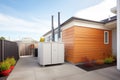 geothermal heat pump unit at an innovative home exterior
