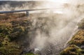 Geothermal Pipe in Grassy Landscape with Hot Spring