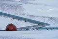 Geothermic plant well and pipes over snow covered landscape Royalty Free Stock Photo