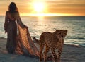 woman and gepard on sand wild desert at sunset animal world nature landscape Royalty Free Stock Photo