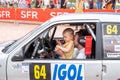 rally driver with his child at the drivers position on the way to the official welcome greeting of the geraldmer rally trophy