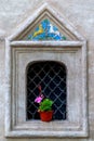 Geraniums in pots on the windowsill with the lattice Royalty Free Stock Photo