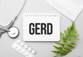 gerd word on notebook,stethoscope and green plant