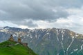 Gergeti Holy Trinity Church and Kazbegi mountain from Stepancminda village in Georgia Royalty Free Stock Photo