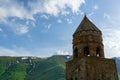 Gergeti Trinity Church, Georgia. Sunrise at the Gergeti Trinity Church with sunrays at chapel at the foot of Kazbegi mountain near Royalty Free Stock Photo