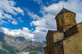 Gergeti Trinity Church, Georgia. Sunrise at the Gergeti Trinity Church with sunrays at chapel at the foot of Kazbegi mountain near Royalty Free Stock Photo