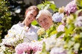 Geriatric nurse with elderly woman in the garden Royalty Free Stock Photo