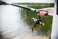 Gerl hands holding a fishing rod and twist