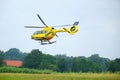 A German ADAC rescue helicopter flying a curve close to the ground