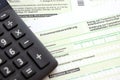 German annual income tax return declaration and calculator lies on accountant table close up. The concept of taxpaying period in