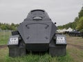 German armoured personnel carrier of world war II in black camouflage on a leafy background .