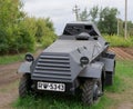 German armoured personnel carrier of world war II in black camouflage on a leafy background .