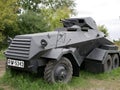 German armoured personnel carrier of world war II in black camouflage on a leafy background .