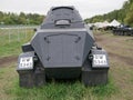 German armoured personnel carrier of world war II in black camouflage on a leafy background .