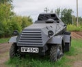 German armoured personnel carrier of world war II in black camouflage on a leafy background .