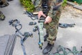 Army soldier holds a lashing ratchet