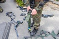 Army soldier holds a lashing ratchet