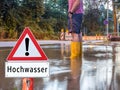German Attention flood man with rubber boots
