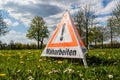 German Attention mowing warning sign Royalty Free Stock Photo