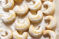 German and Austrian traditional Christmas cookies vanilla crescents on white tray powdered with castor sugar. Top view Royalty Free Stock Photo
