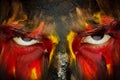 German sports fan patriot. Painted country flag on angry man face. Devil Eyes close up Royalty Free Stock Photo