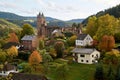 German bertrada castle in the Eifel with shining autumn leaves Royalty Free Stock Photo