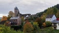 German bertrada castle in the Eifel with shining autumn leaves