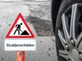 German Beware of road damage Royalty Free Stock Photo