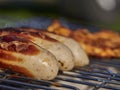 german bratwurst pork sausage cooking on a barbecue grill Royalty Free Stock Photo