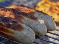 german bratwurst pork sausage cooking on a barbecue grill Royalty Free Stock Photo