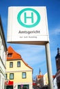 German bus stop sign in a city on Amtsgericht Royalty Free Stock Photo