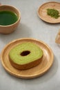 German cake, Green tea Baumkuchen with latte Royalty Free Stock Photo