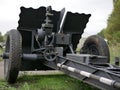 German cannon during the second world war on a cloudy summer day painted in black camouflage.