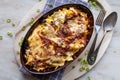 German cheese spaetzle with roasted onions in a rustic casserole dish