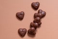 German chocolate covered gingerbread hearts on coral colored background. Royalty Free Stock Photo