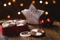 German christmas biscuits, checkered cookies, with homely decoration on wooden table