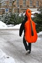 Man with red Cello in winter Royalty Free Stock Photo