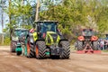 German claas axion tractor drives on track by a traktor pulling event