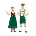 German couple wearing traditional bavarian costumes. Man in national folk shorts, suspenders and hat. Woman in