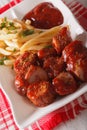 German cuisine: currywurst with french fries close-up. vertical Royalty Free Stock Photo