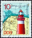 GERMAN DEMOCRATIC REPUBLIC - CIRCA 1974: A stamp printed in Germany shows Buk Lighthouse and marine map, circa 1974.