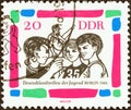GERMAN DEMOCRATIC REPUBLIC - CIRCA 1964: A stamp printed in Germany shows Young gymnasts, circa 1964.